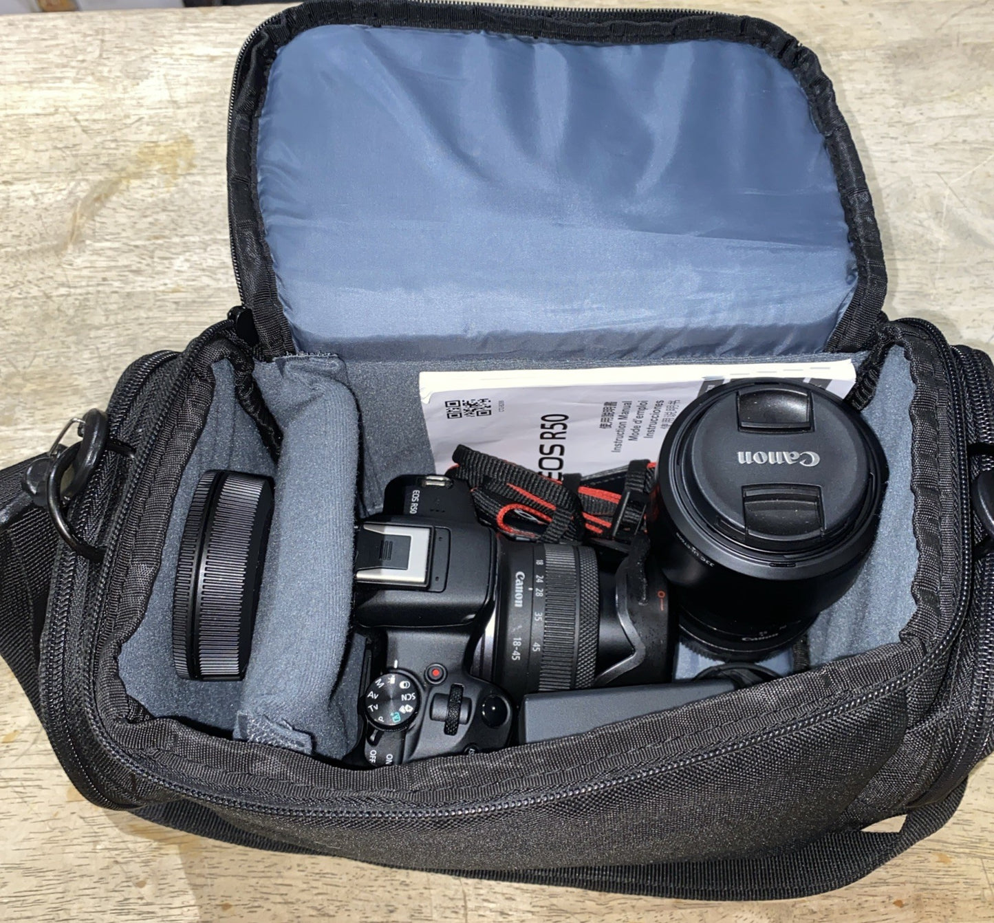 Canon EOS R50 Mirrorless Camera 18-45mm, 55-210mm Lens, 1 Battery, Charger, Bag